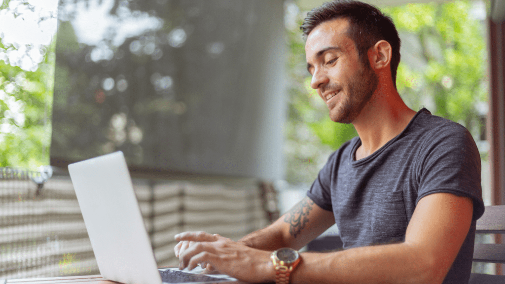 A person sitting at a desk with a laptop