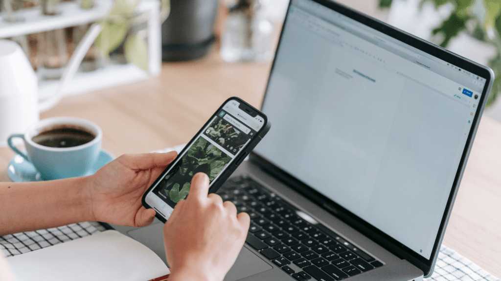 smartphone and laptop at the table