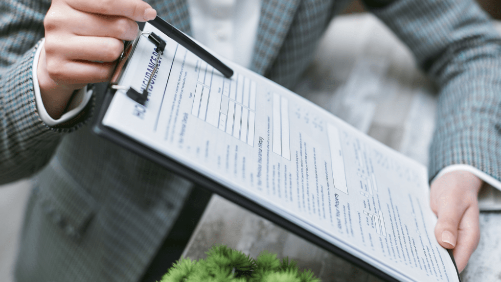 a person in a business suit holding a clipboard