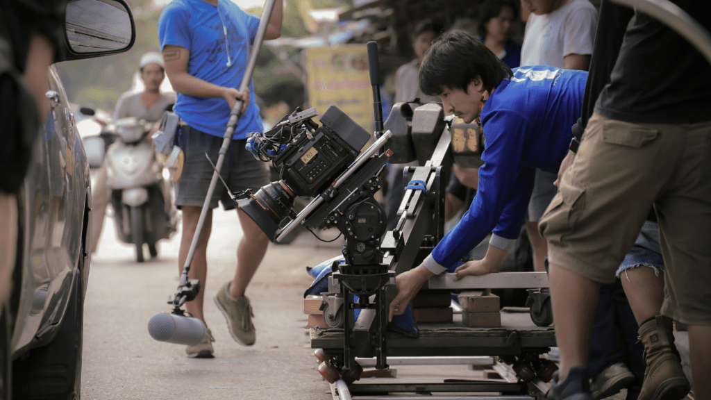 a group of people holding a camera