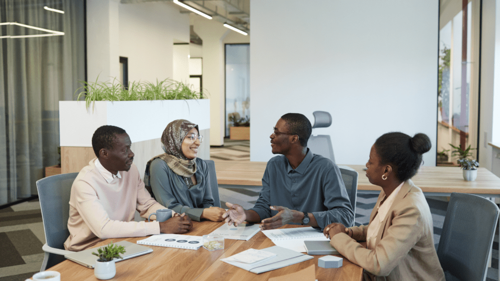 a group of people working on a project at a desk